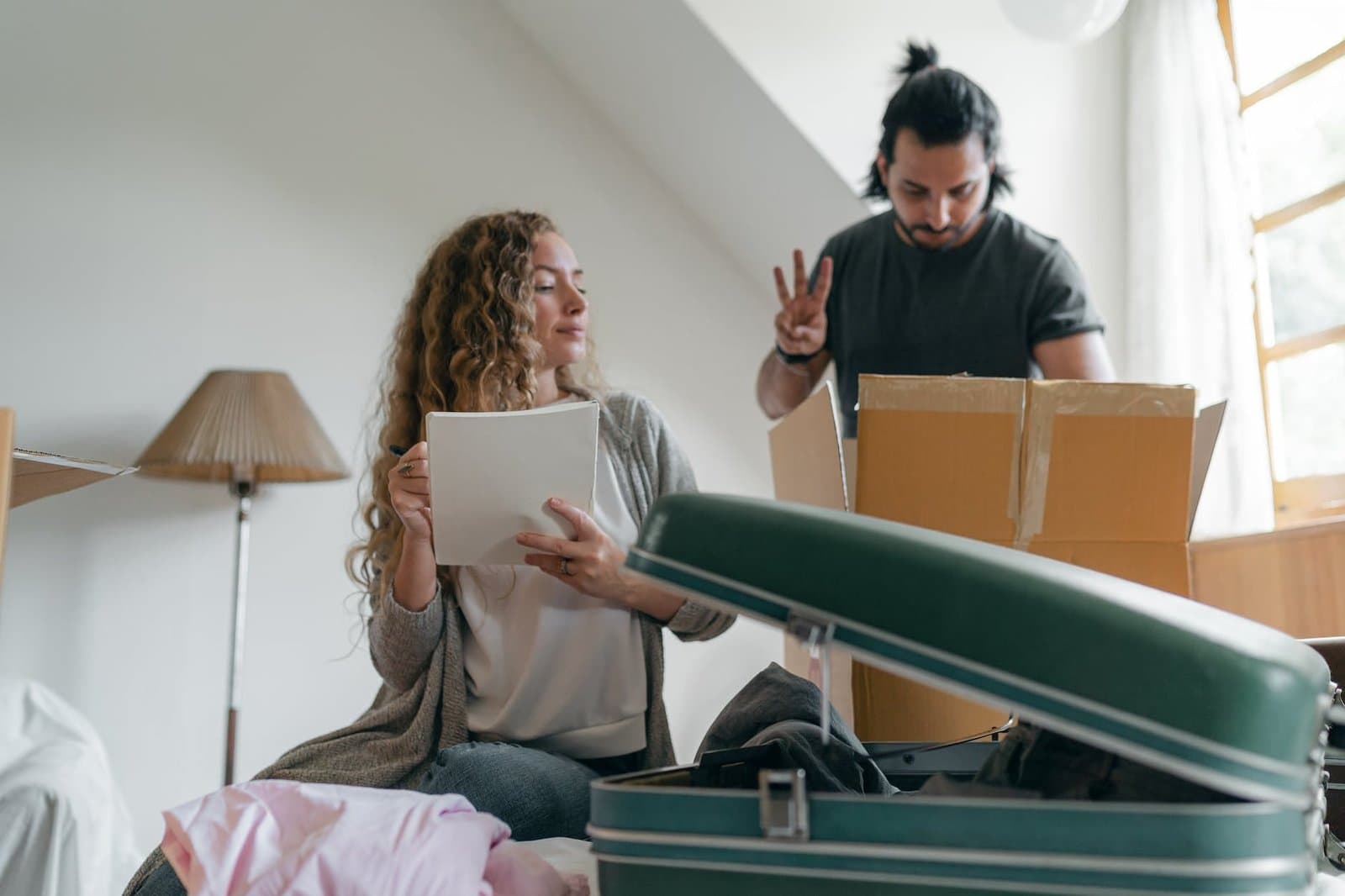 focused couple packing stuff before Moving to Land O' Lakes