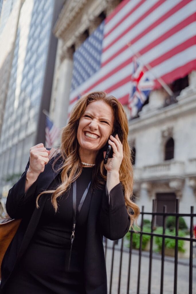 excited woman winning real estate offer